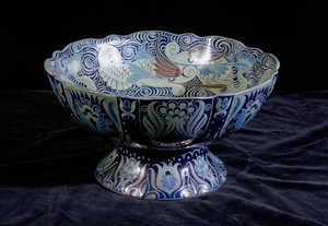 Punch Bowl with ship in the centre and a frieze of fish and waves round the rim by William de Morgan